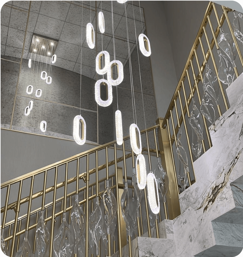 Pendant lights and gold railing along the staircase