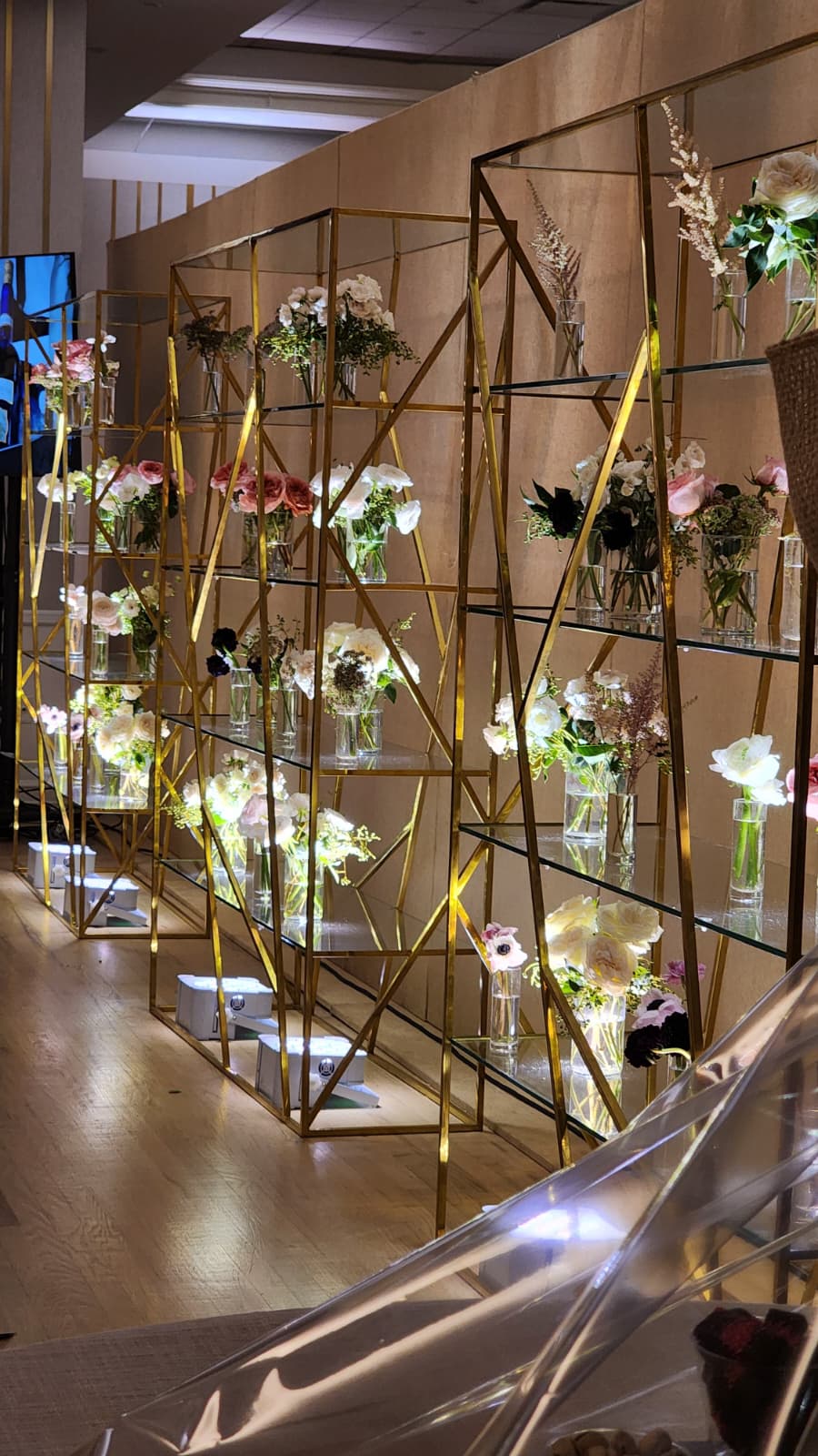 A gold-framed flower wall display