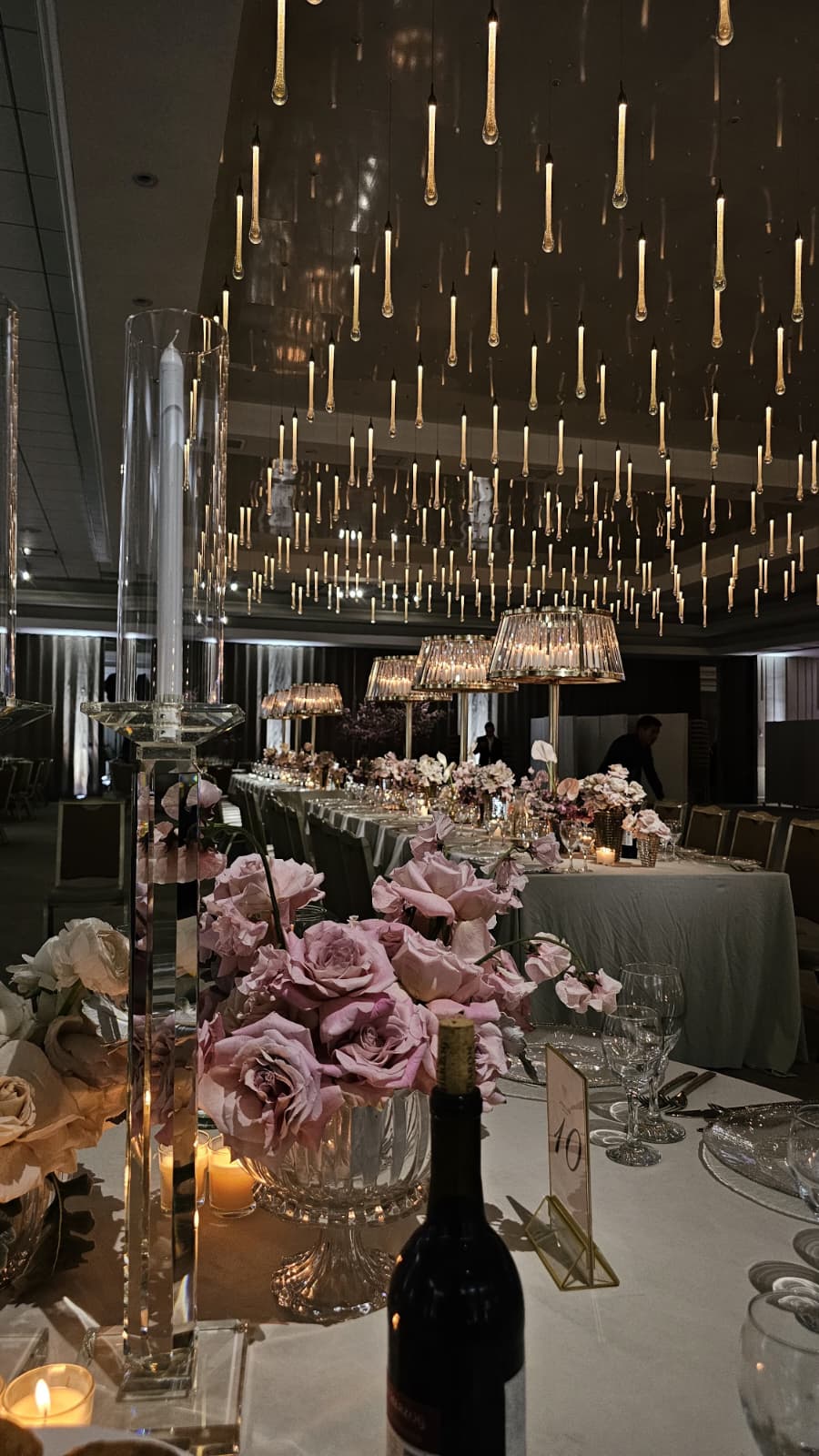 Pink roses and candlelight on a table