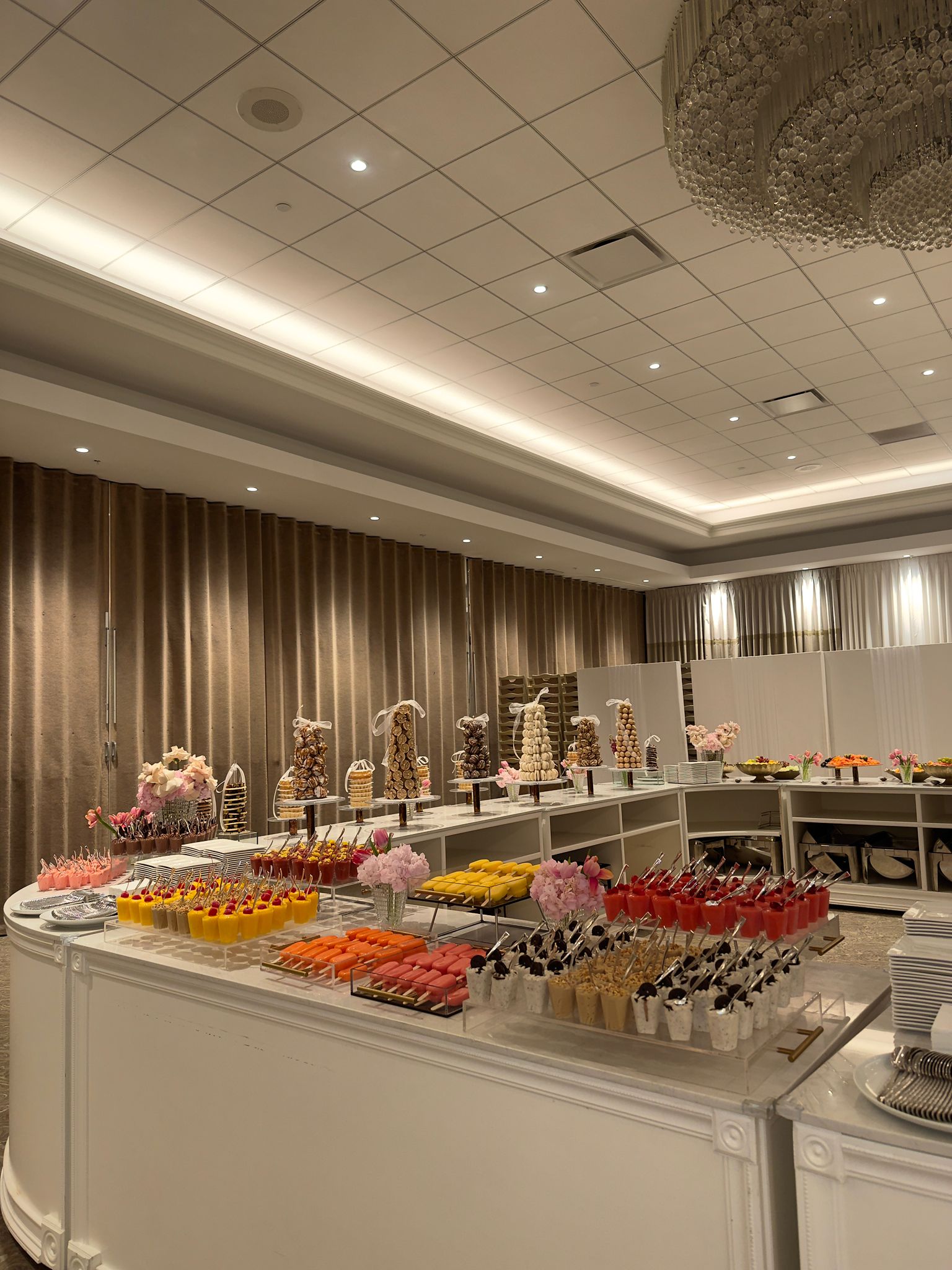A colorful sweets table in the ballroom