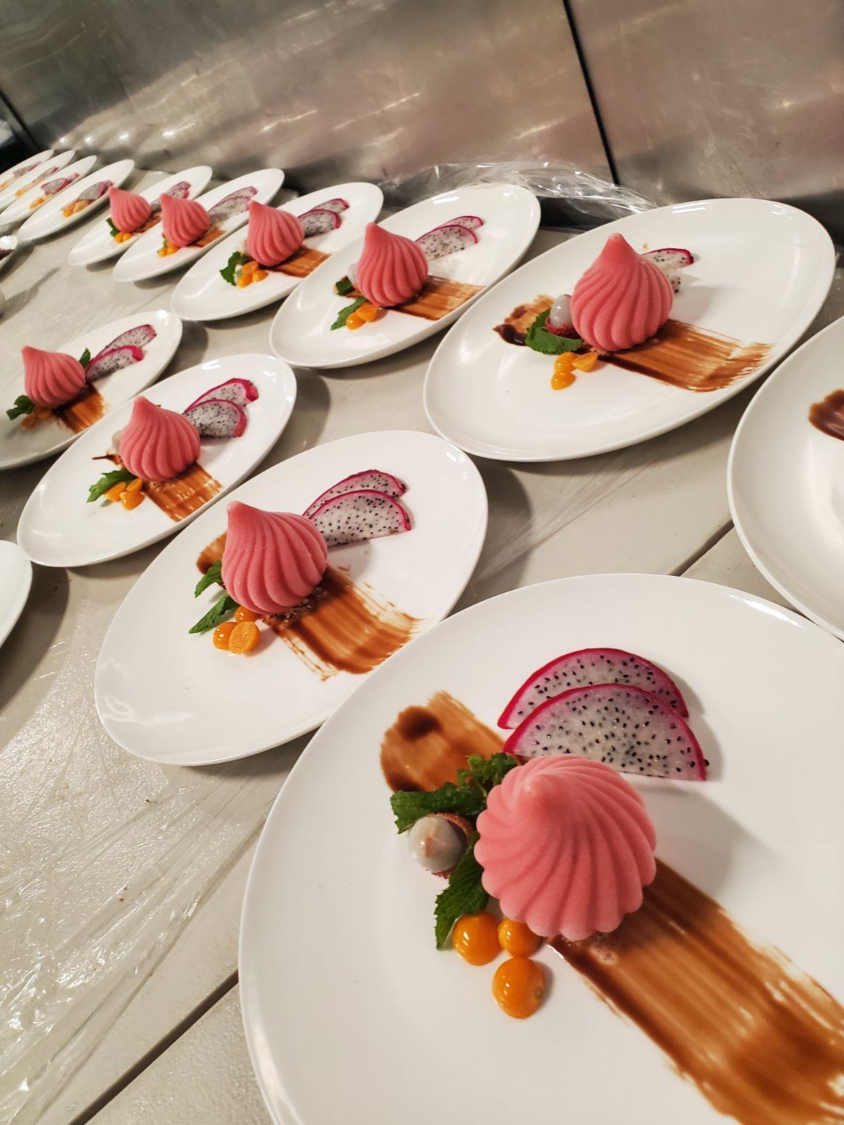 Plated desserts lined up for service