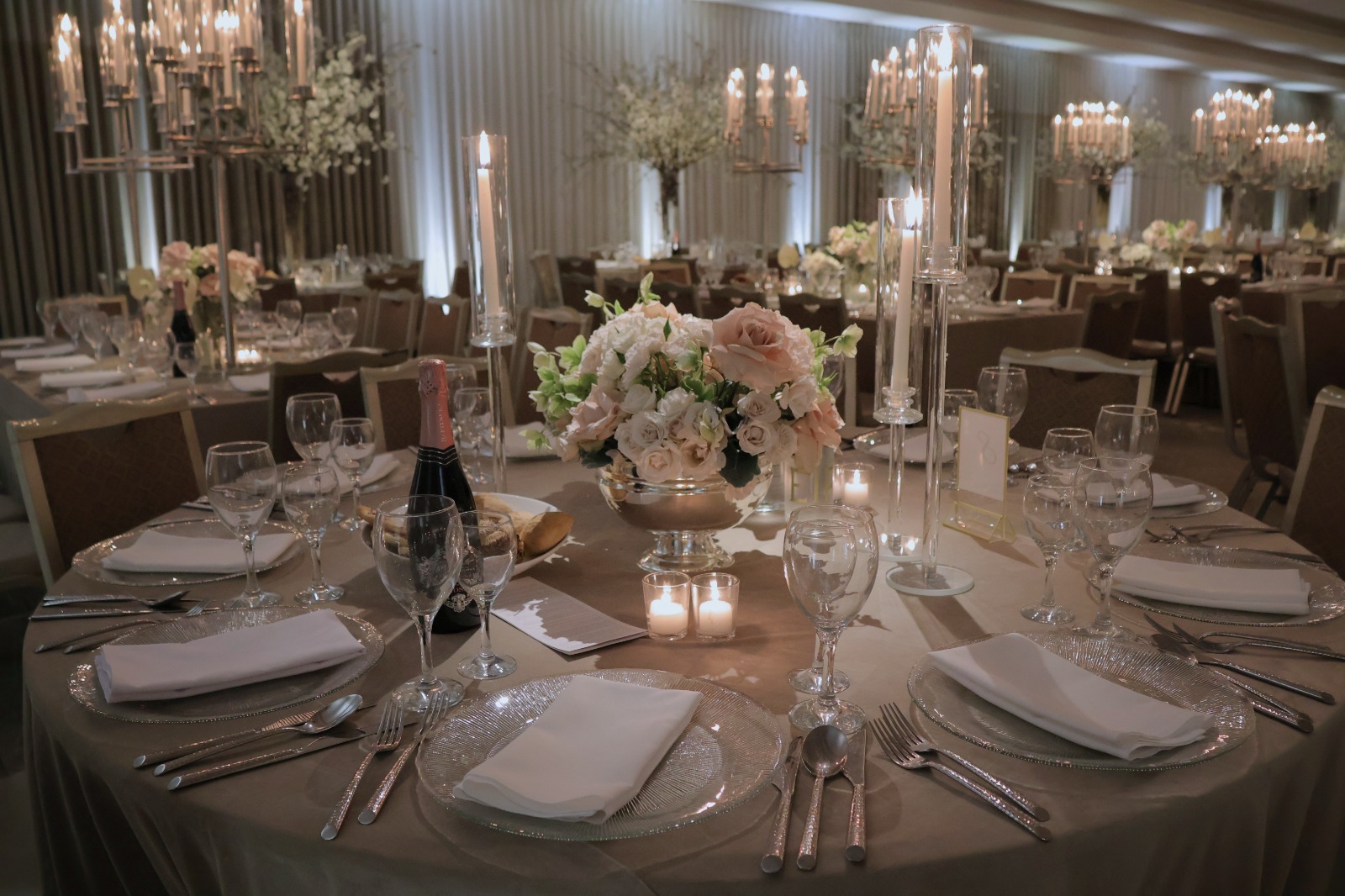 Tables set with tall candelabras and blush florals